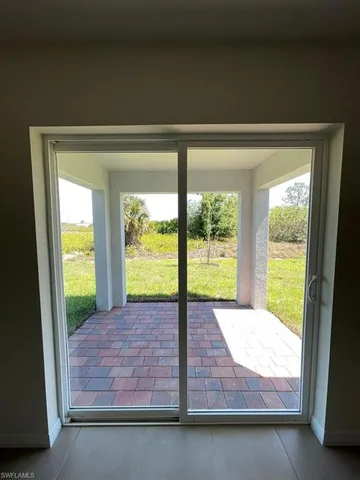a view of an empty room and window