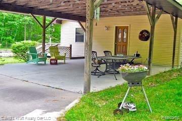 3660 Sand Road Port Austin, MI 48467 - Photo 14 of 14 3660SandCoverdPatio.jpg