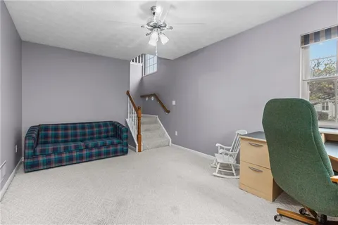 a bedroom with furniture and a window