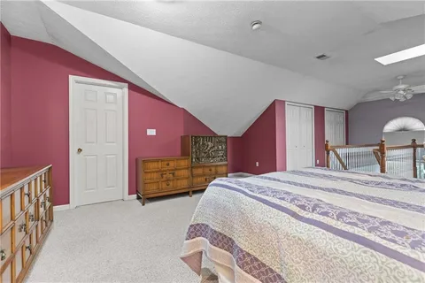 a bed room with a bed and a dresser