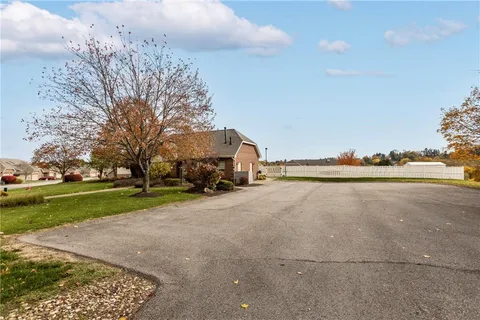 a view of a city street and trees