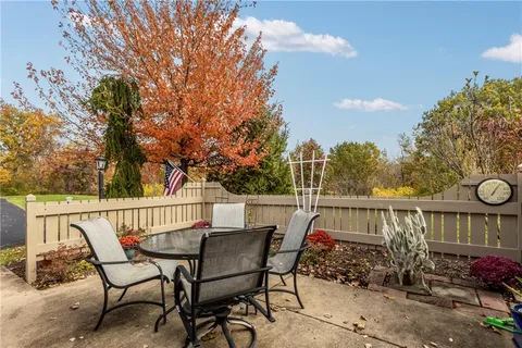 a view of a chairs and table on the terrace