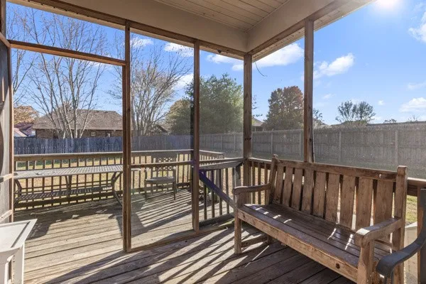 a view of a wooden balcony with a bench