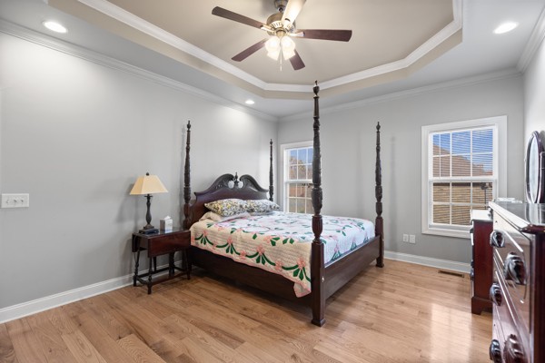 4017 Brimestone Way Greenbrier, TN 37073 - Photo 6 of 13 a bedroom with a bed and a chandelier