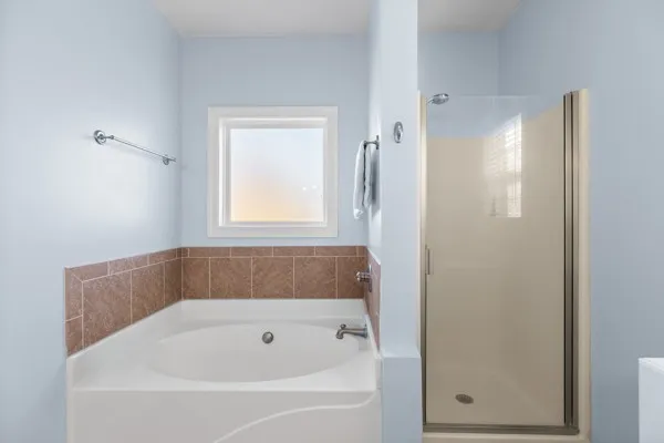 a white bath tub sitting next to a window
