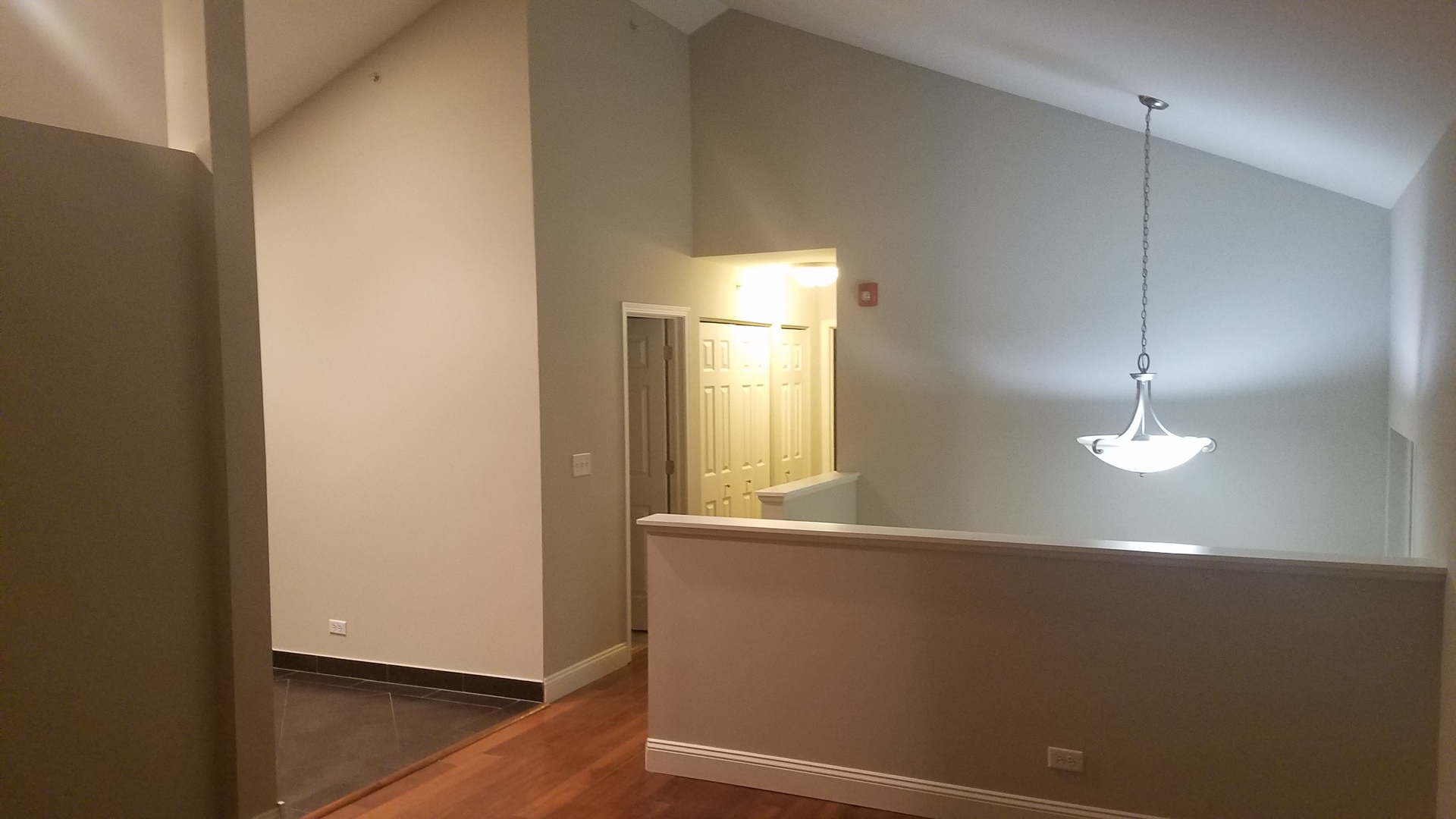 10331 Kerry Ridge Court Chicago Ridge, IL 60415 - Photo 7 of 24 a view of an empty room with wooden floor and a window