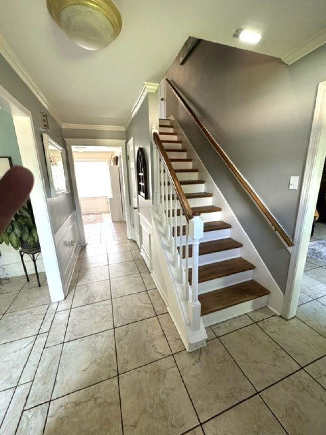1897 Corbin Road Germantown, TN 38139 - Photo 17 of 22 Foyer featuring a grand staircase with wood-finish treads and white risers, a wood handrail, and white balusters