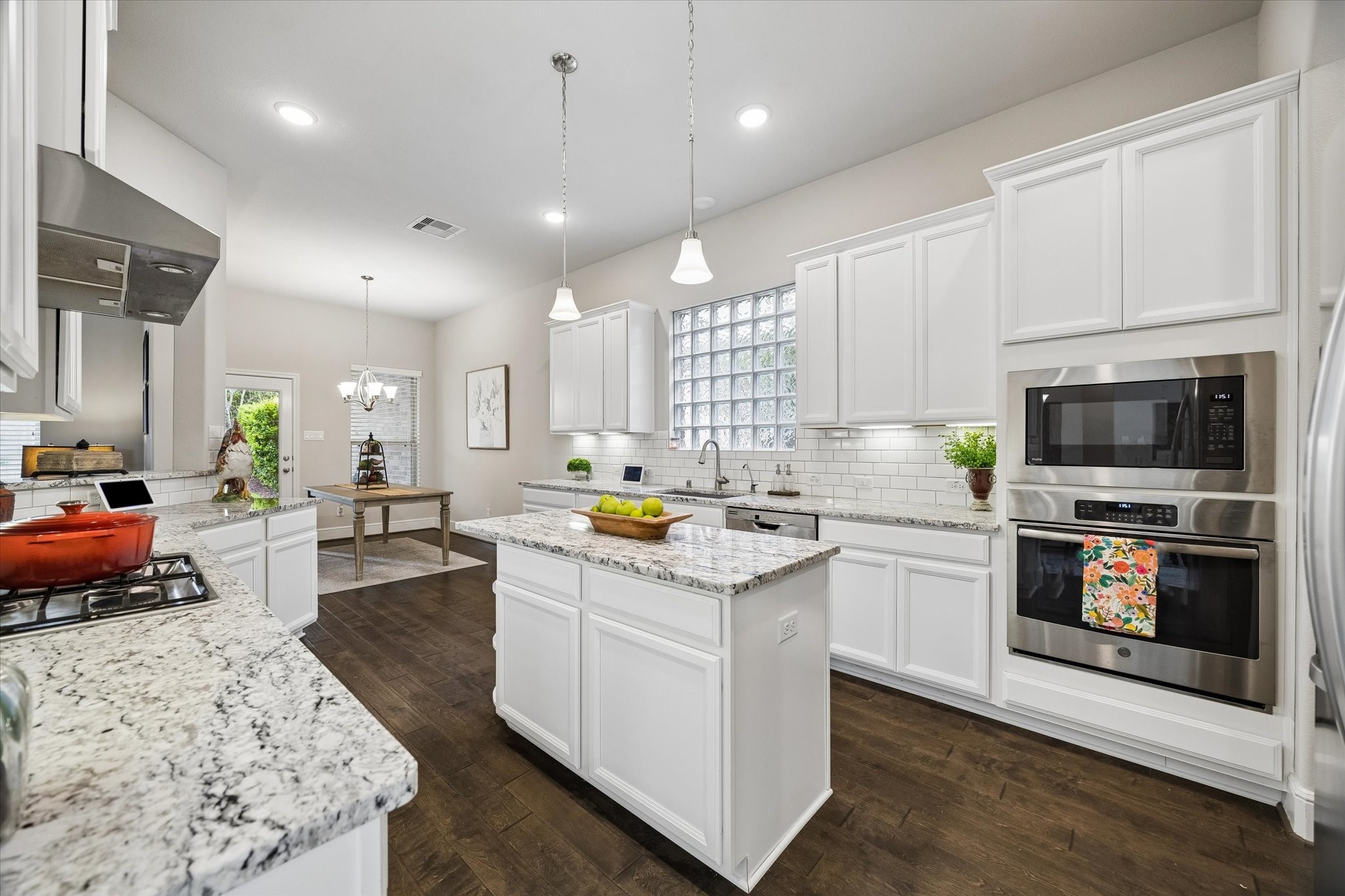 19 Peace Tree Way Tomball, TX 77375 - Photo 17 of 36 Chef's kitchen featuring a standalone island, stainless steel appliances, and ample cabinet space.