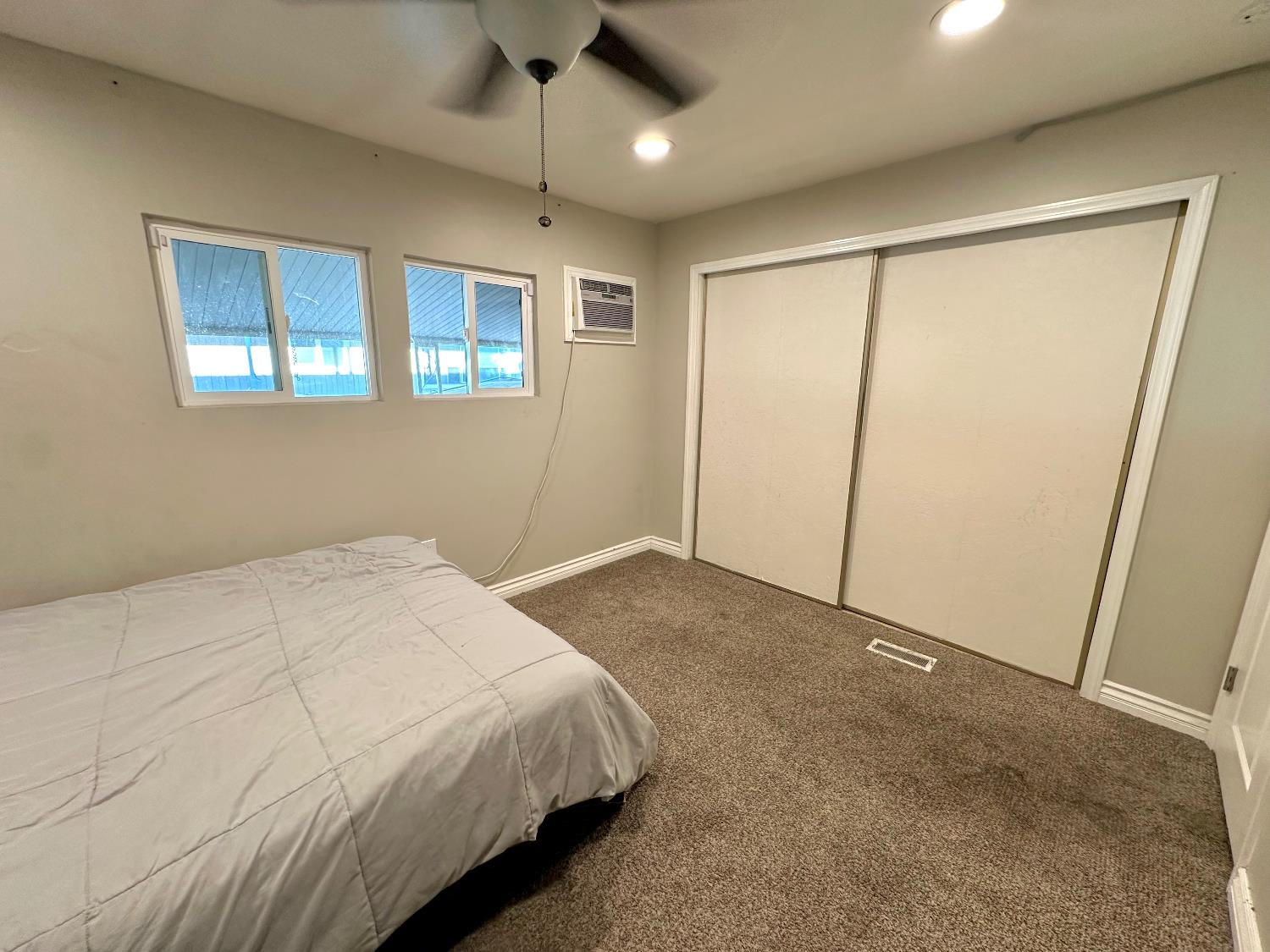 3435 Marfargoa Road, Unit 74 Stockton, CA 95215 - Photo 14 of 21 a bedroom with a large bed and a window