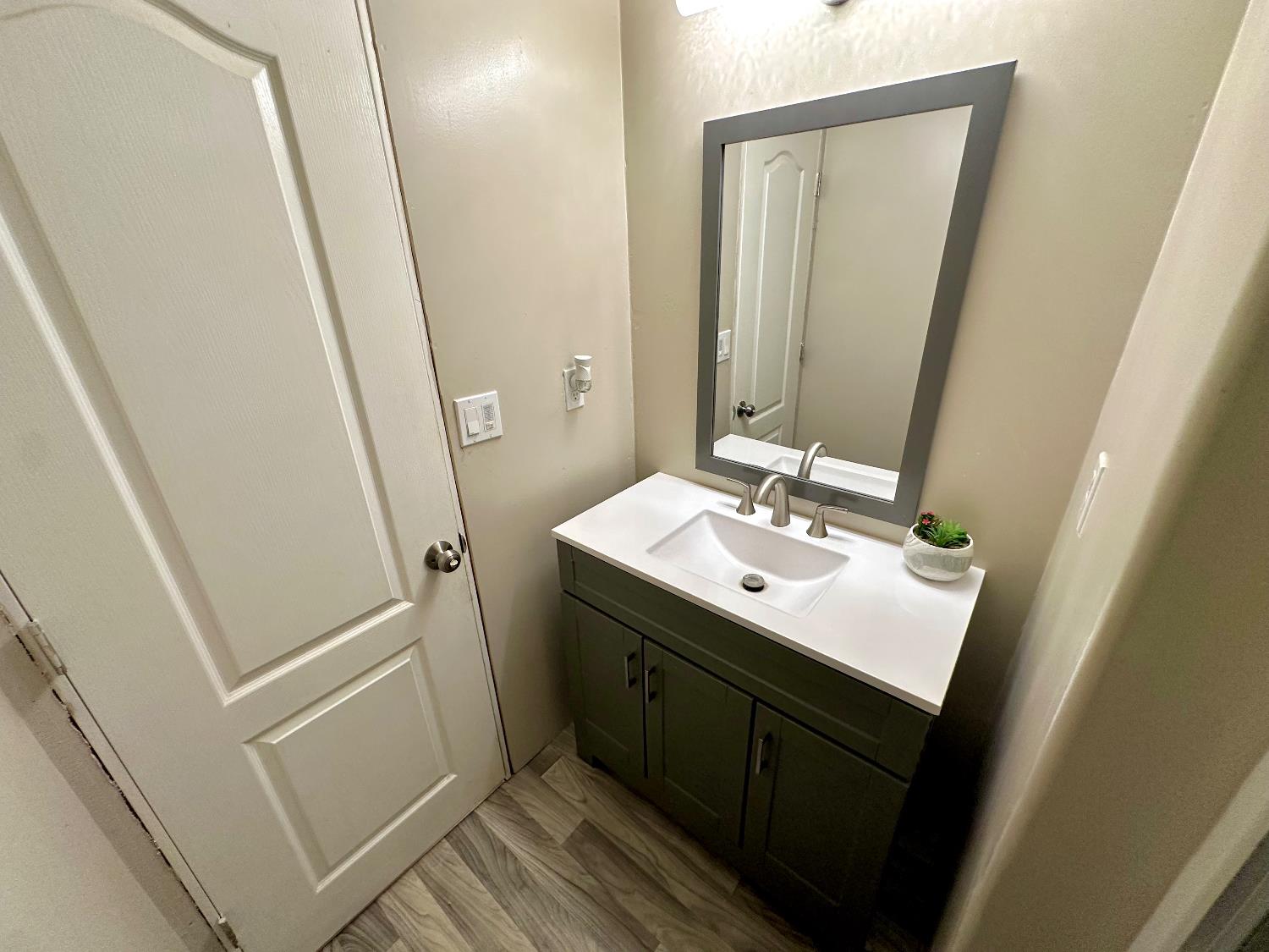 3435 Marfargoa Road, Unit 74 Stockton, CA 95215 - Photo 17 of 21 a bathroom with sink and mirror