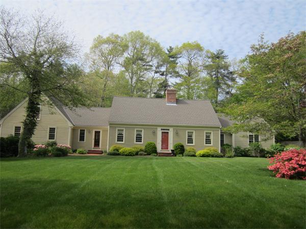 9 Bishop Road Rochester, MA 02770 - Photo 1 of 9 a front view of a house with a garden and trees