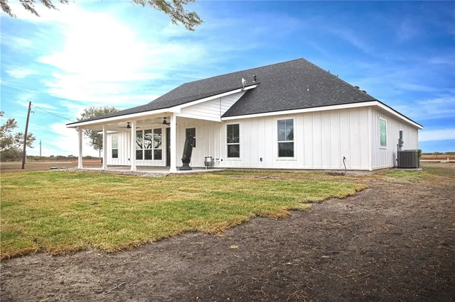 a front view of house with garden