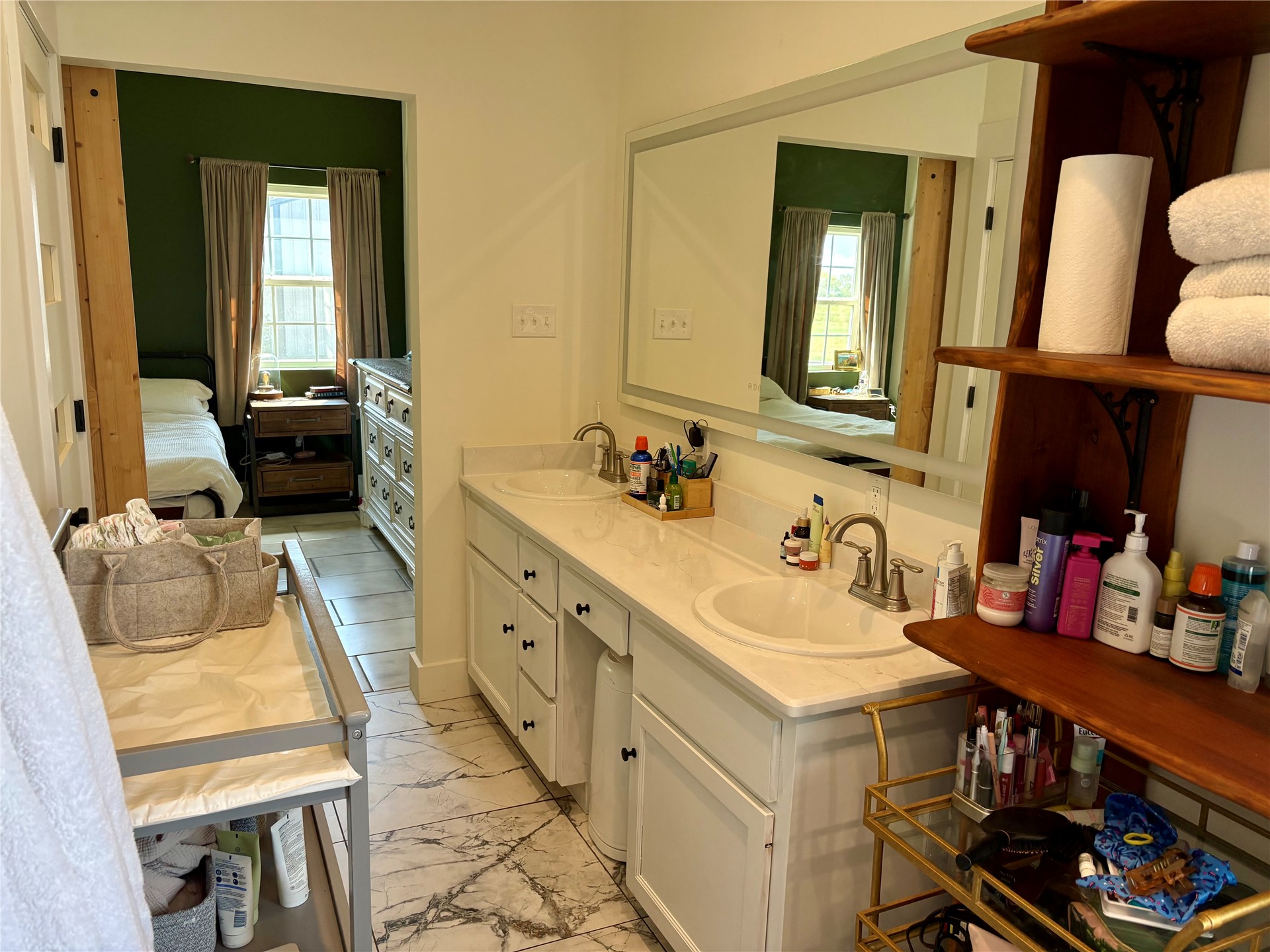 313 Nauvoo Hills Road Caddo, OK 74729 - Photo 17 of 41 Dual vanity with undermount sinks, stone countertop, and an expansive mirror