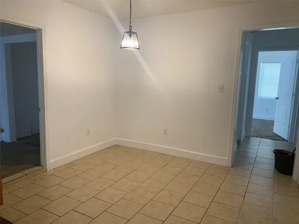 an empty room with wooden floor