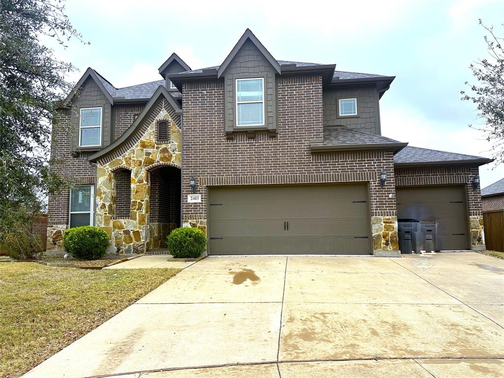 2403 Wilson Drive Anna, TX 75409 - Photo 2 of 13 a front view of a house with garden