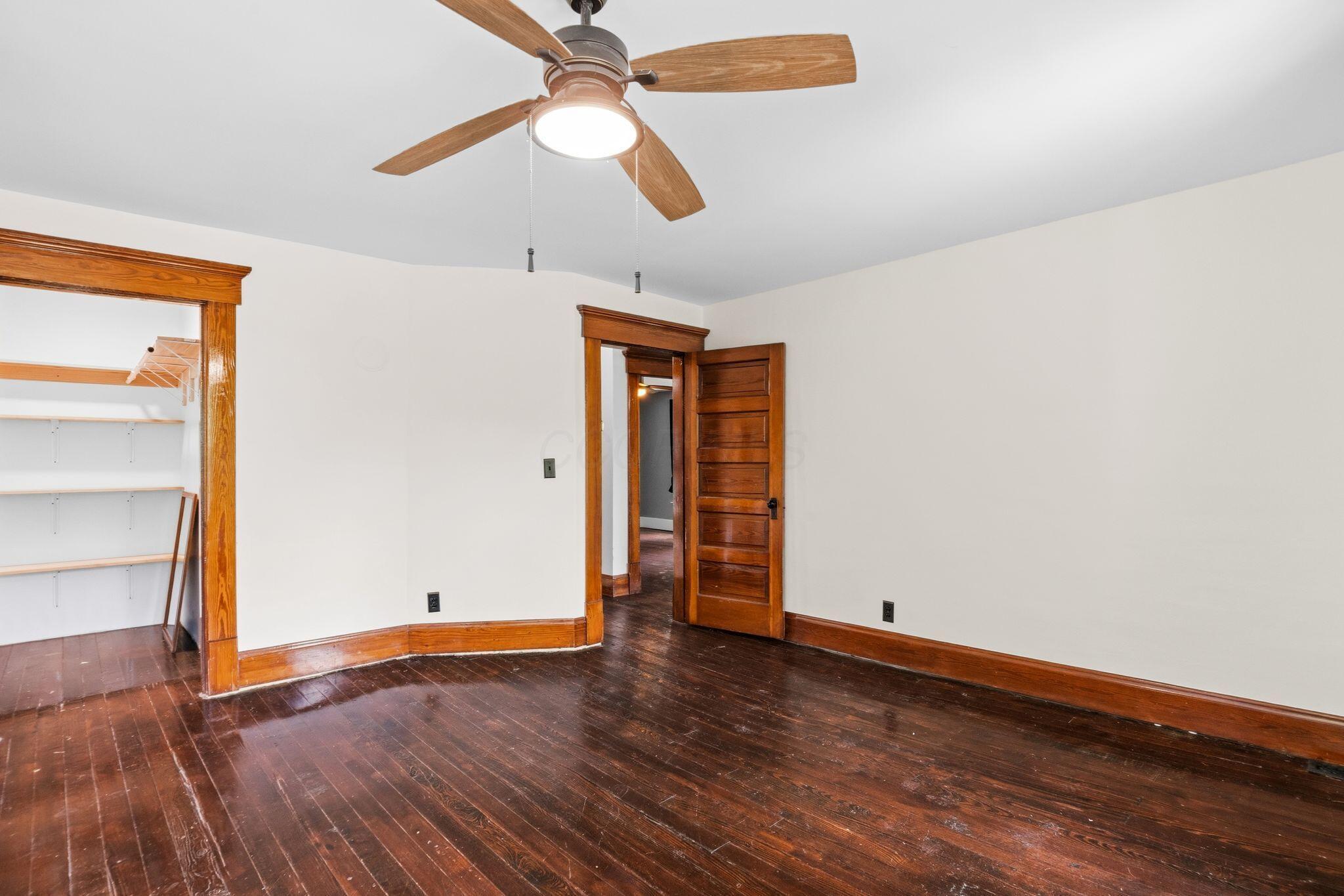 107 Price Road Columbus, OH 43230 - Photo 19 of 51 Hardwood flooring complemented by original wood trim and baseboards
