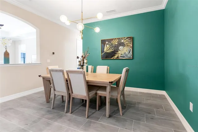 a spacious bedroom with a bed and a book shelf