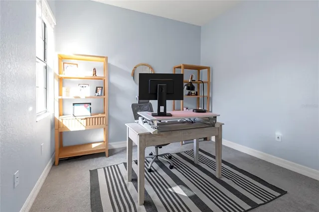 a view of a backyard with sitting area