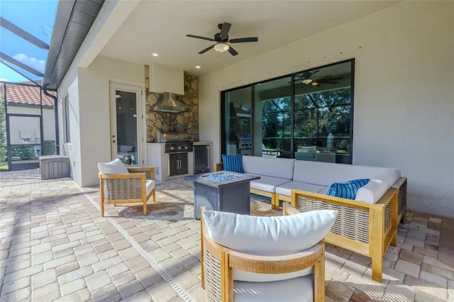 a view of a house with a yard and potted plants