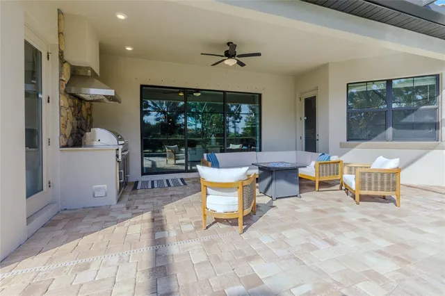 an aerial view of residential house with outdoor space and lake view