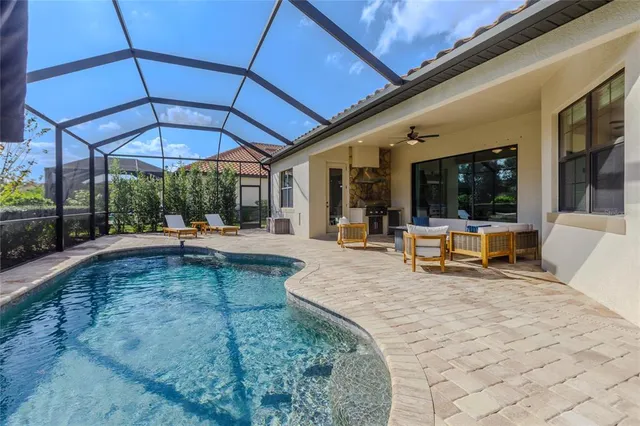 an aerial view of a house with a lake view