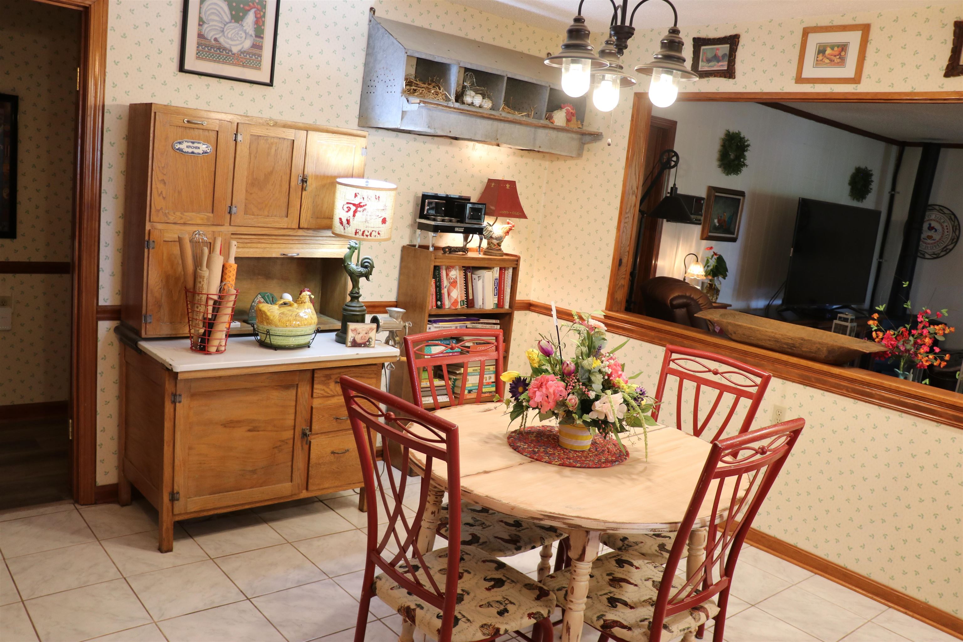 937 Kelleys Chapel Road Burlison, TN 38015 - Photo 12 of 27 Dining area featuring wallpapered walls and light tile patterned floors