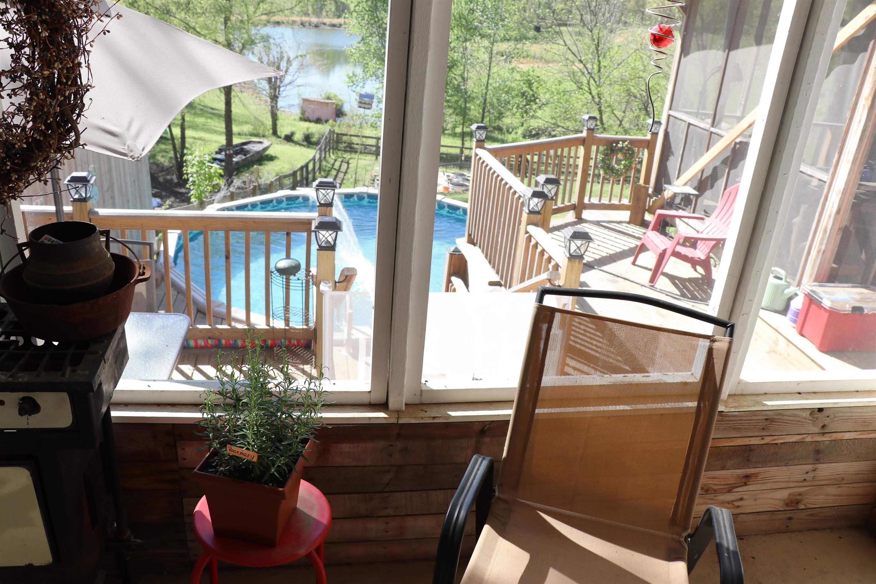 937 Kelleys Chapel Road Burlison, TN 38015 - Photo 13 of 27 Wooden deck with an outdoor pool, a grill, a water view, and a patio