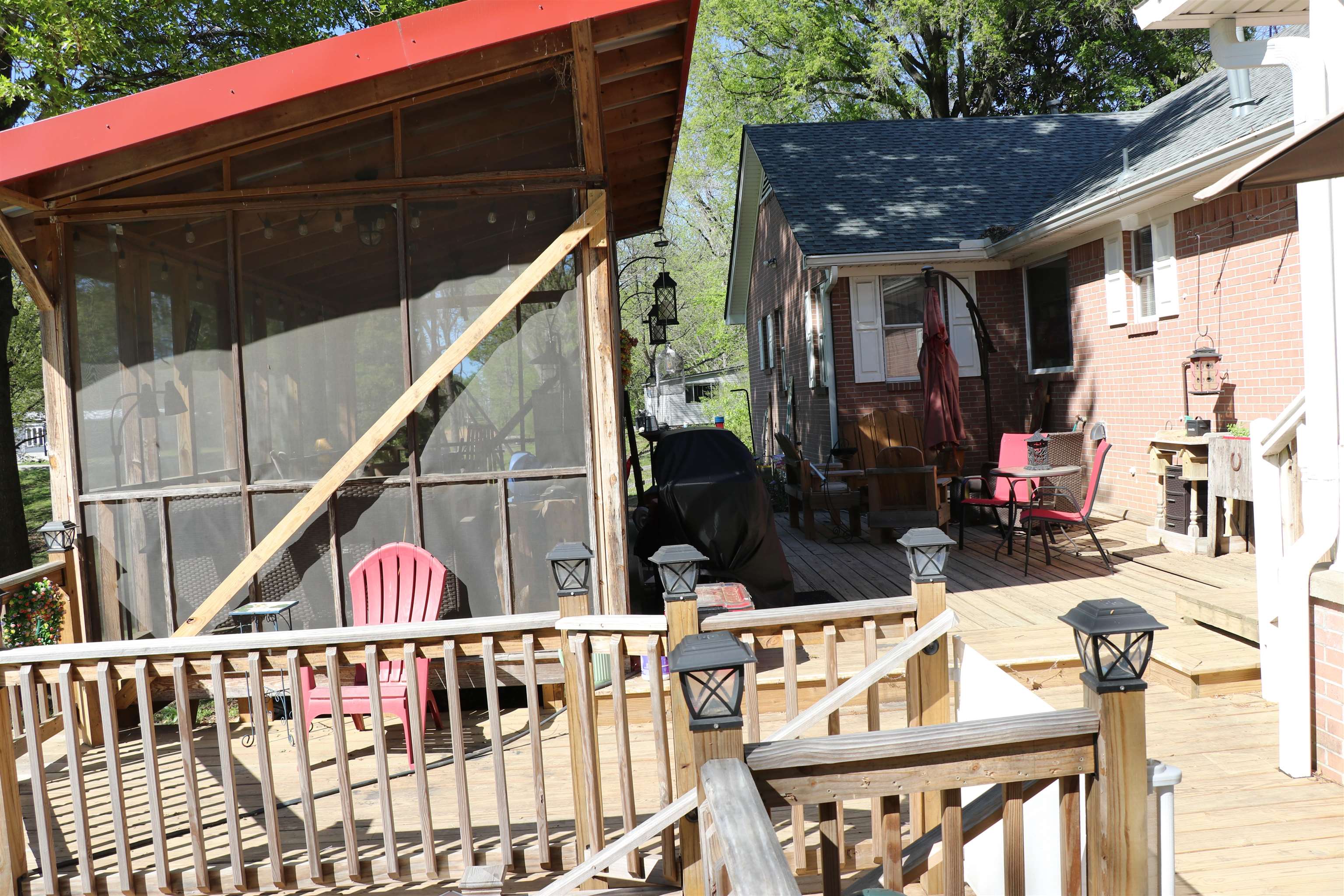 937 Kelleys Chapel Road Burlison, TN 38015 - Photo 18 of 27 Deck with outdoor dining space and a sunroom