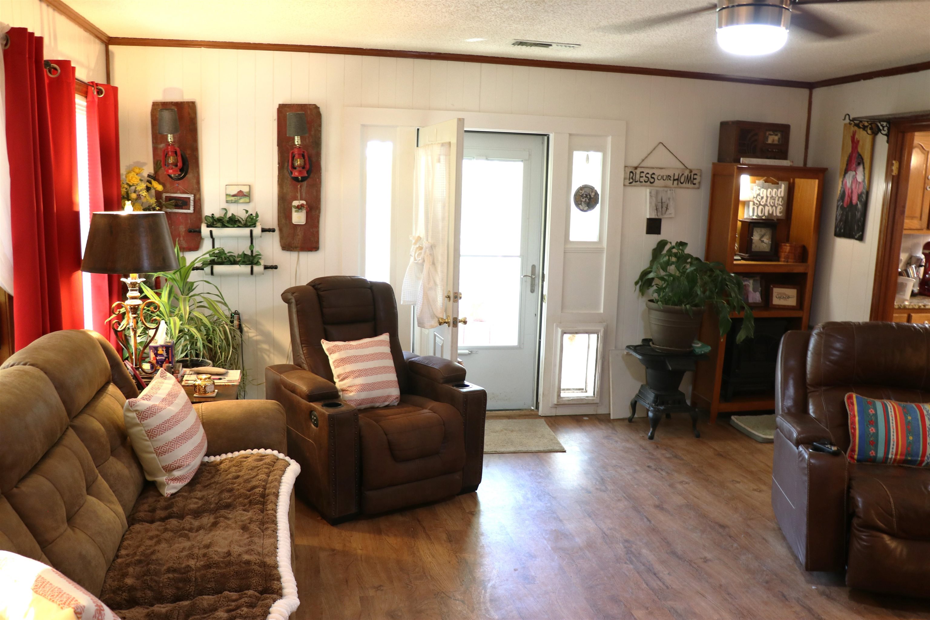 937 Kelleys Chapel Road Burlison, TN 38015 - Photo 10 of 27 Living room featuring ornamental molding, wood finished floors, and ceiling fan