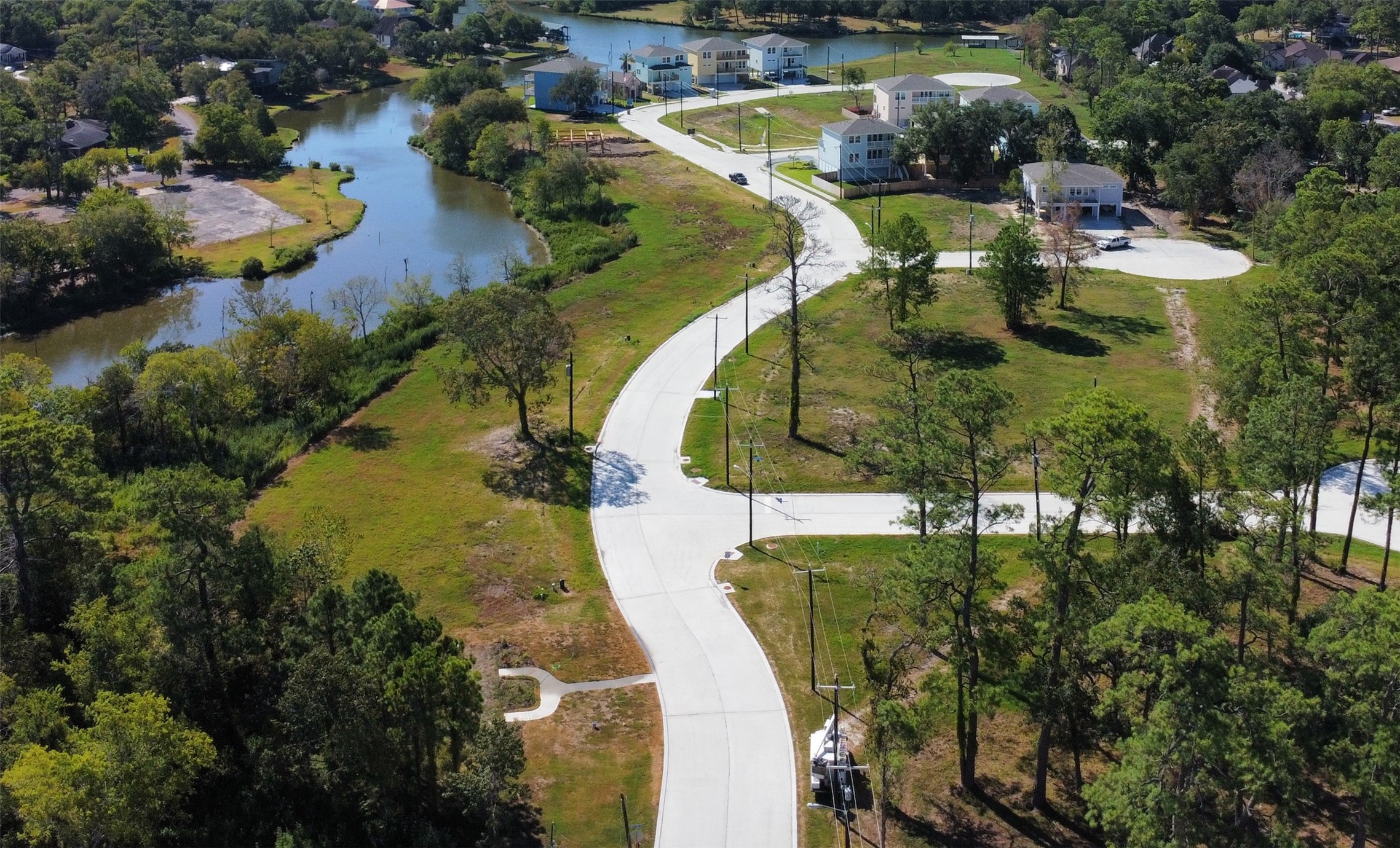 1902 Ashlee Court Dickinson, TX 77539 - Photo 2 of 3 an aerial view of lake residential house with outdoor space and swimming pool