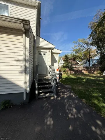 a view of a house with backyard