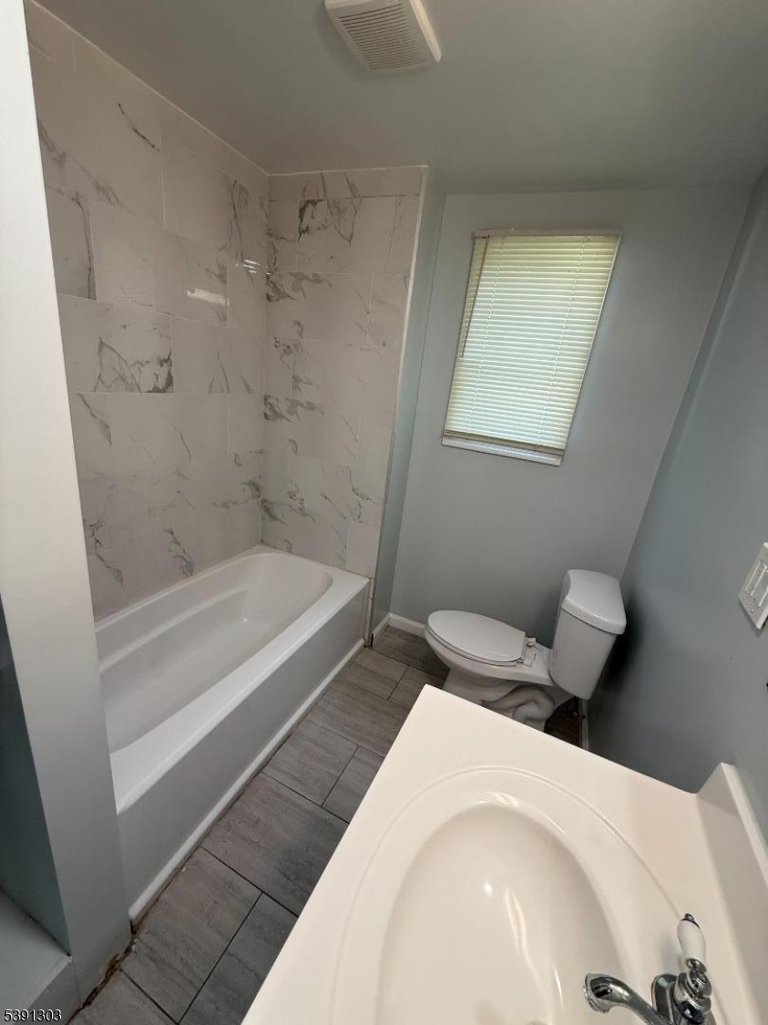 280 William Street, Unit A Rahway, NJ 07065 - Photo 18 of 26 a bathroom with a bathtub and shower