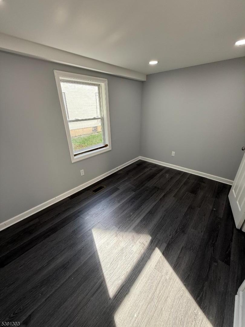 280 William Street, Unit A Rahway, NJ 07065 - Photo 20 of 26 a view of an empty room and wooden floor
