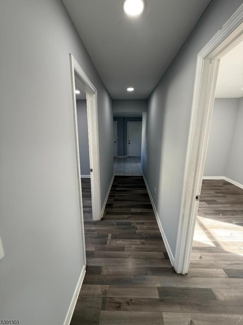 280 William Street, Unit A Rahway, NJ 07065 - Photo 23 of 26 a view of a hallway with wooden floor and staircase