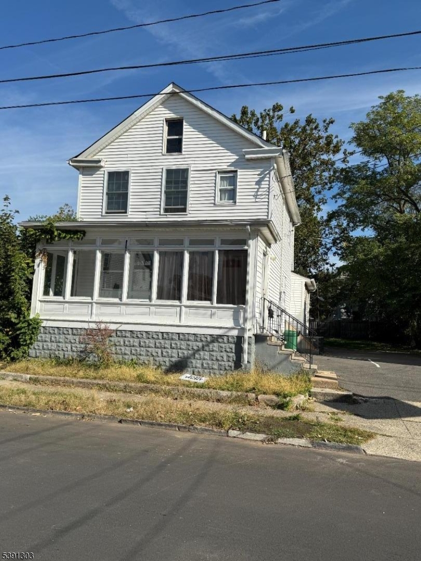 280 William Street, Unit A Rahway, NJ 07065 - Photo 4 of 26 a front view of a house with a garden and mountain view