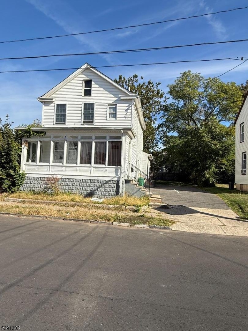 280 William Street, Unit A Rahway, NJ 07065 - Photo 5 of 26 a front view of a house with a yard