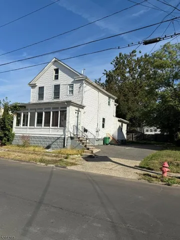 a view of a house with a street