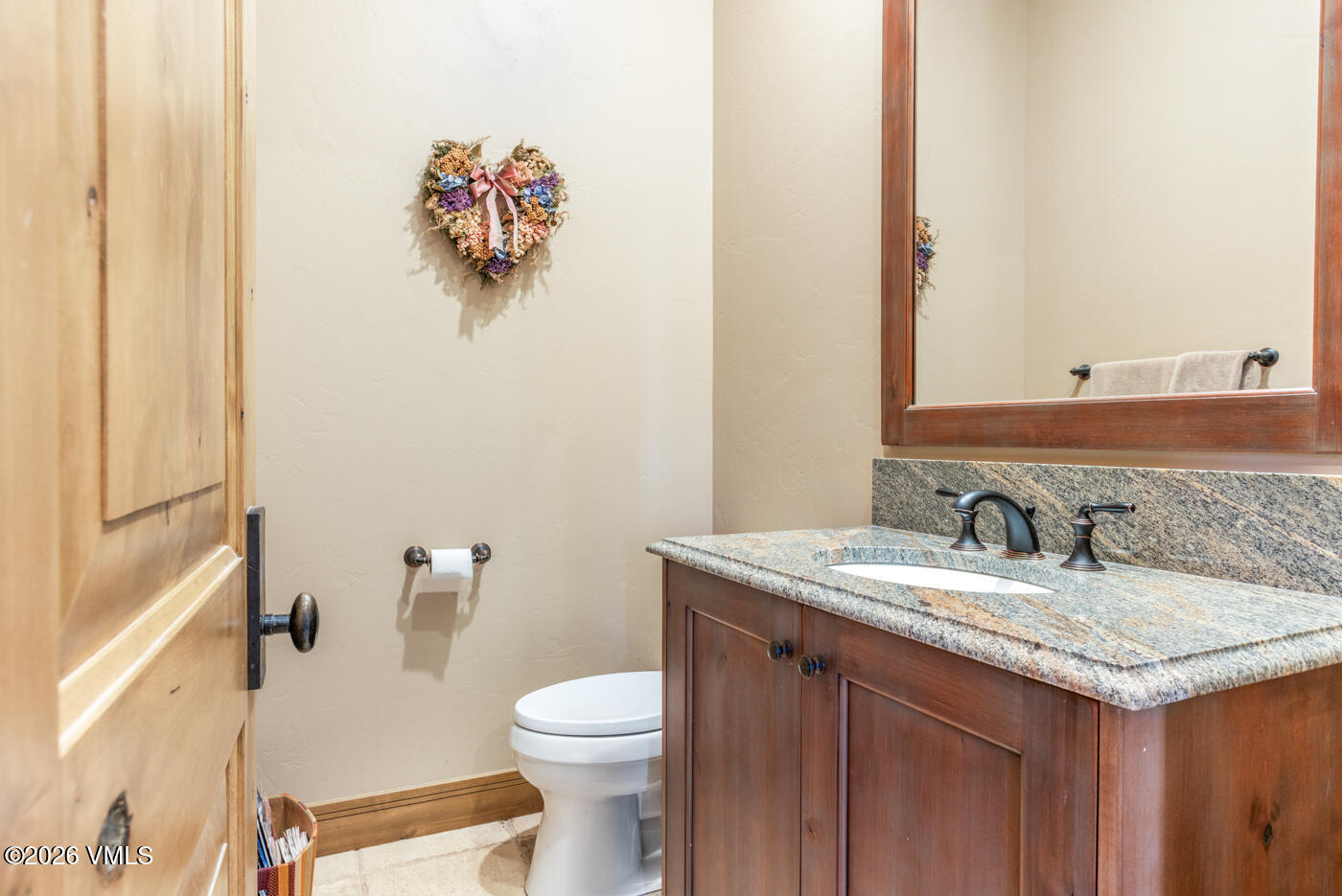 34900 Colorado River Road McCoy, CO 80463 - Photo 32 of 46 a bathroom with a granite countertop sink and a mirror
