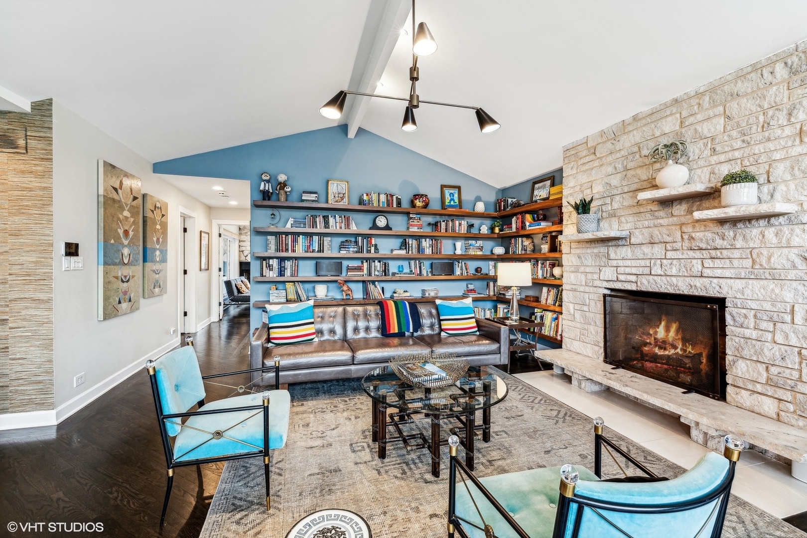 205 Bloomingbank Road Riverside, IL 60546 - Photo 15 of 46 a living room with a fireplace and a book shelf