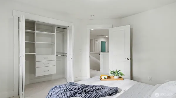 a bedroom with a bed and a cabinets