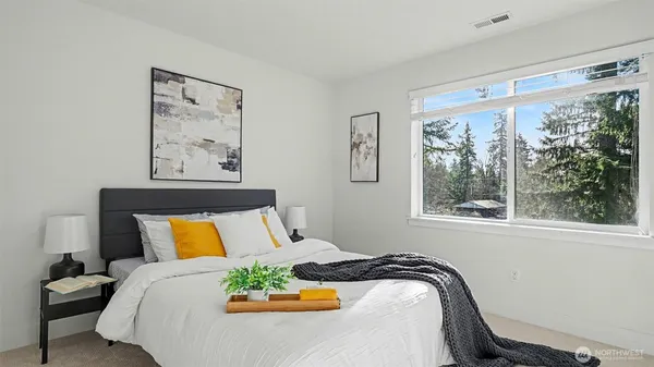 a bedroom with a bed and window