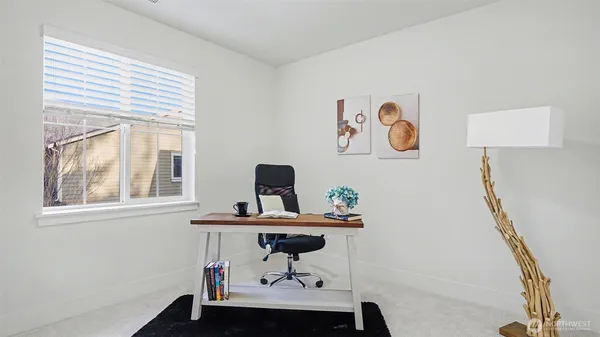 a bedroom with a bed and cabinets