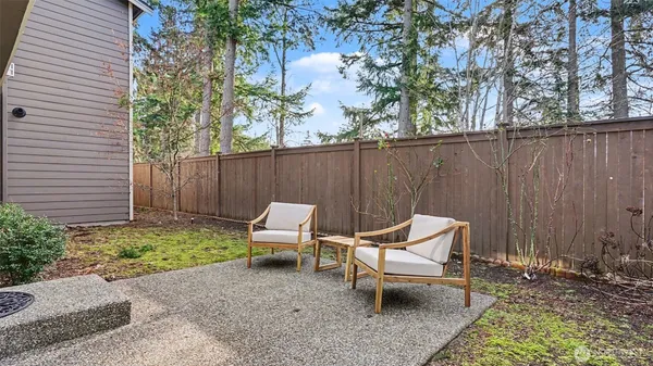 a view of a livingroom with furniture and a window