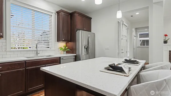 a kitchen with a sink a stove and refrigerator