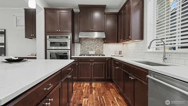 a kitchen with a sink and cabinets