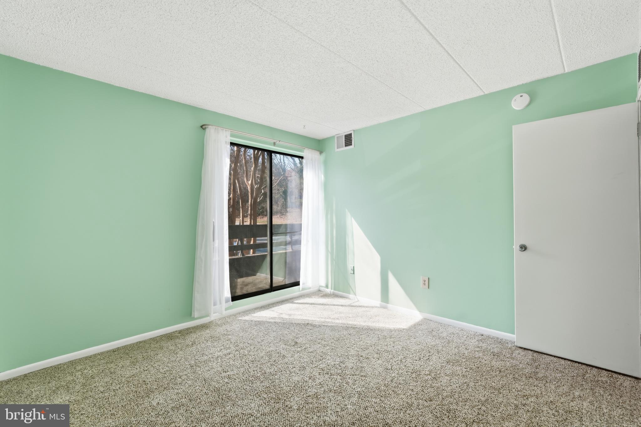 11566 Rolling Green Court, Unit 12/200A Reston, VA 20191 - Photo 19 of 25 a view of an empty room with a window