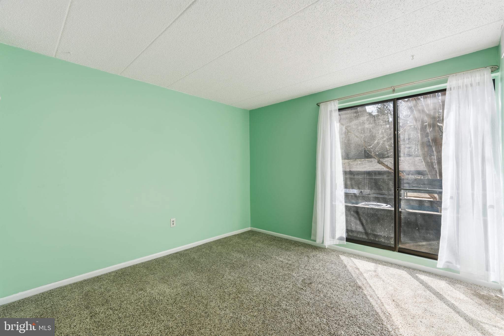11566 Rolling Green Court, Unit 12/200A Reston, VA 20191 - Photo 20 of 25 a view of an empty room with a window