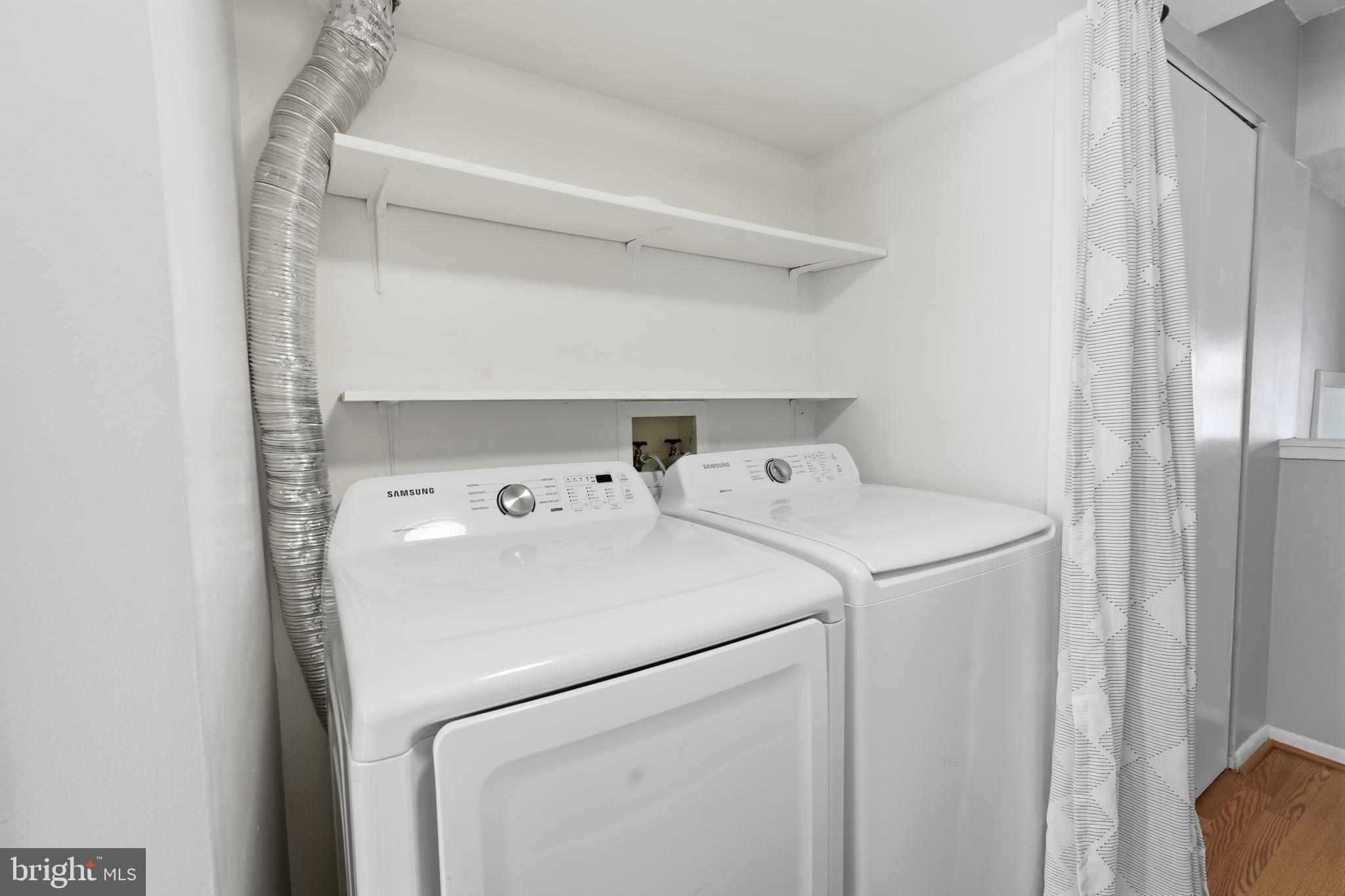 11566 Rolling Green Court, Unit 12/200A Reston, VA 20191 - Photo 23 of 25 a utility room with dryer and washer