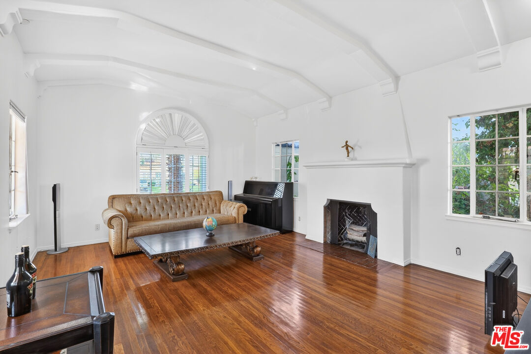 1544 South Point View Street Los Angeles, CA 90035 - Photo 12 of 67 a living room with furniture and a fireplace