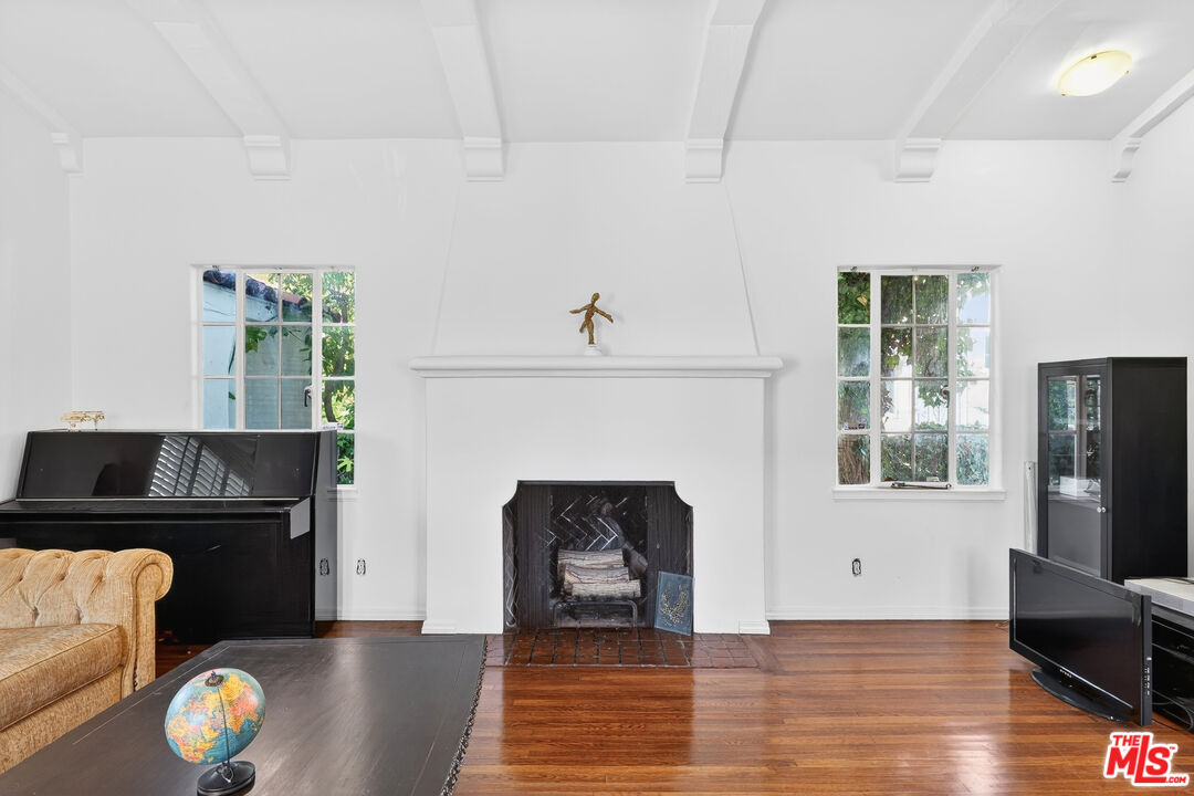 1544 South Point View Street Los Angeles, CA 90035 - Photo 15 of 67 a living room with furniture and a fireplace